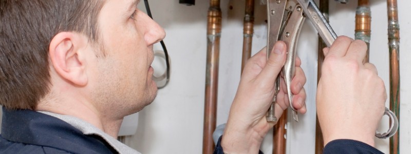 Engineer fixing boiler